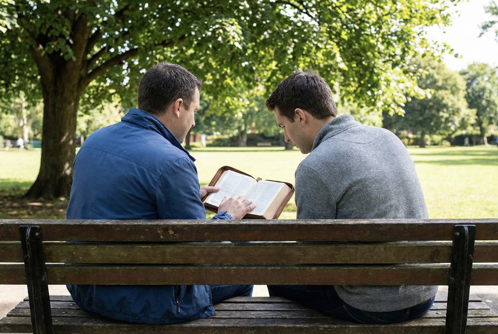 Two men reading the Bible together during the Share-Your-Story campaign